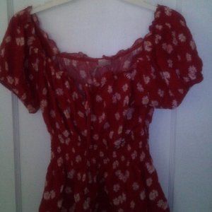Red muffin top blouse with floral designs with drawstring